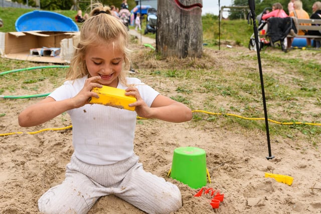 Lilly Rose Preston (7) having fun in the sand at Norley Hall family fun day. Photo: Kelvin Stuttard
