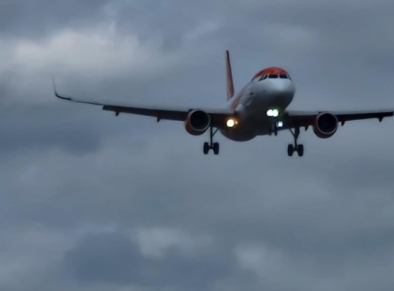 A plane heads to Manchester Airport bringing holidaymakers home