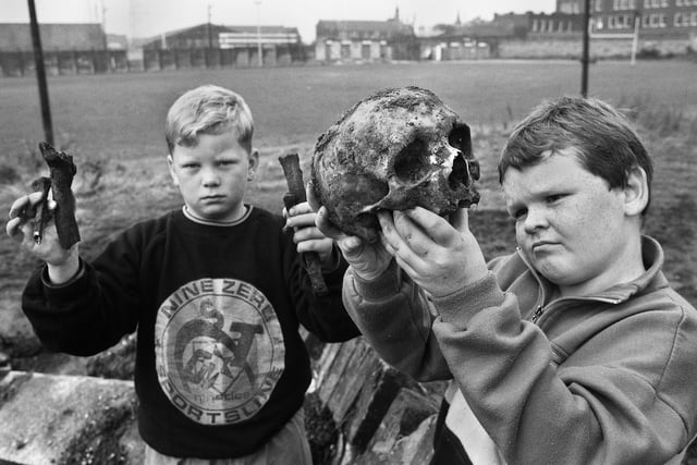 Pals Sean Kinnear and Lee Price with parts of the gruesome find of human bones which they came across on land being excavated to extend Wigan Rugby League Club's boundary at Central Park on Wednesday 30th of September 1992.  Several suggestions were made as to the skeletons' origins being of soldiers from the Battle of Wigan Lane in 1651, plague victims from the 17th century or from a pauper's graveyard.  The bones were eventually reburied on the site.