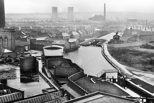 A misty day view from Higher Ince along the Leeds and Liverpool canal towards Westwood power station around 1970.