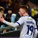 Luke Robinson celebrates with the away fans at Mansfield in midweek
