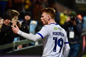 Luke Robinson celebrates with the away fans at Mansfield in midweek