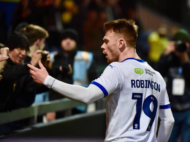 Luke Robinson celebrates with the away fans at Mansfield in midweek