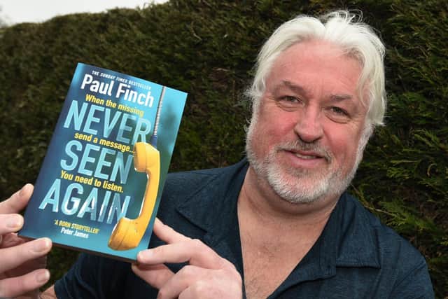 Paul Finch with his latest book, Never Seen Again