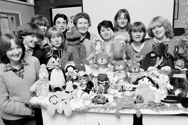 Wigan College pre-care students with soft toys they made for Christmas treats for youngsters