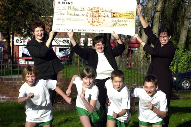 2001 - St Philip's Primary School cross country runners and sponsor cheque from Stephenson's Solicitors.