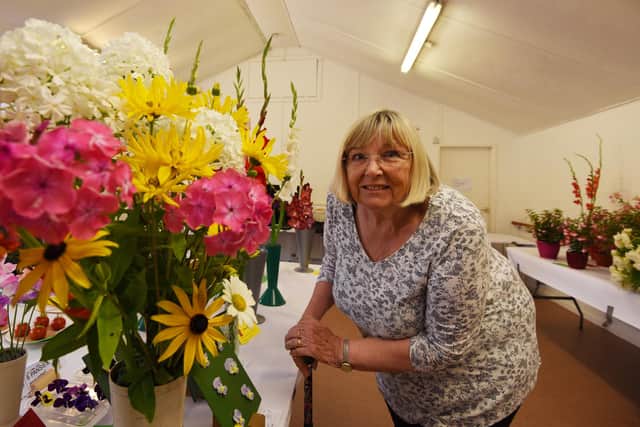 Jean Hayes admires the flowers on display at Shevington Garden Club's summer show