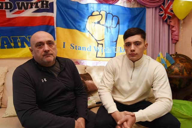 Pictured are family friend Oleg Sinechko and son Alexander
