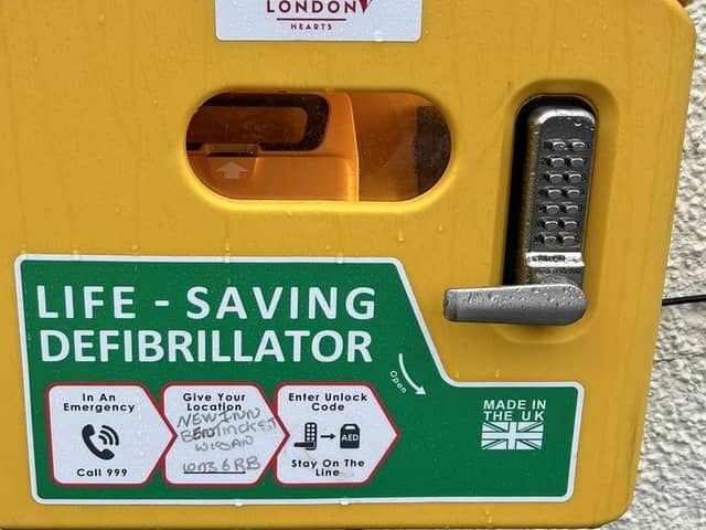 One of the defibs installed at eight pubs in Wigan