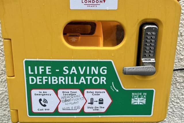 One of the defibs installed at eight pubs in Wigan
