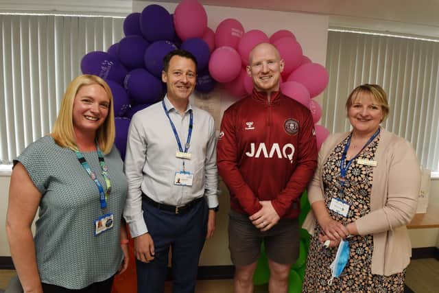 From left, Staff wellbeing manager Zoe Garnett,  Silas Nicholls chief executive of Wrightington, Wigan and Leigh Teaching Hospitals NHS Foundation Trust (WWL), Wigan Warriors player Liam Farrell and chief of people Alison Balson, at the official opening of The Wellness at Work Lounge.