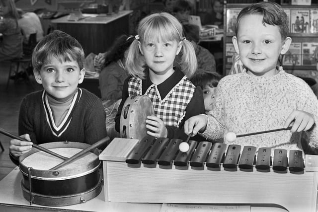 Musical trio Michael Walkden, Diane Clift and Merryck Lowe at Evans County Infants School, Ashton, in October 1976.