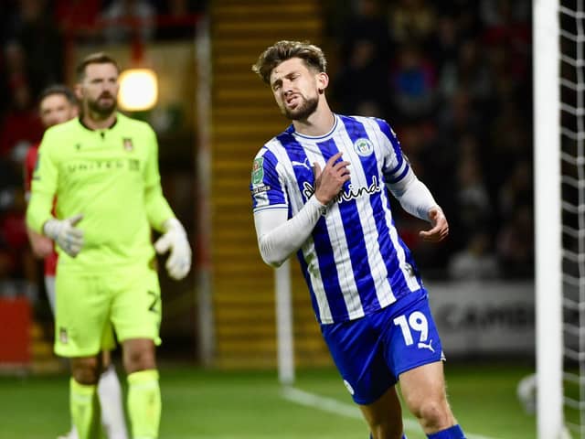 Substitute Callum Lang couldn't help Latics force a later winner at Wrexham before the visitors crashed out of the Carabao Cup on penalties