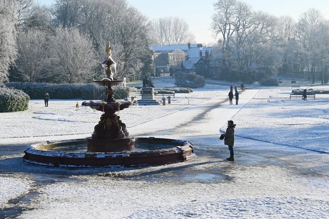 Wigan snow scenes - People make the most of the winter weather as snow falls on Mesnes Park, Wigan.