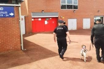Police and a sniffer dog at Leigh Sports Village