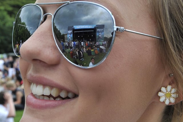 The main stage reflected in a spectators glasses.