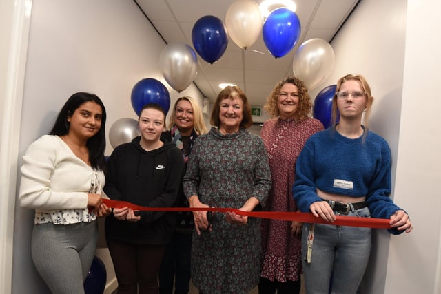 Coun Jenny Bullen, centre, cuts the ribbon to officially open the centre, pictured with care leavers and director of childrens services Colette Dutton, third from left, and Service Lead Children in Care & Care Leavers Jacqui Hardman, second from right.