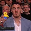 Tom Aspinall holds up a duck to underline his belief Jon Jones has been ducking a unification fight