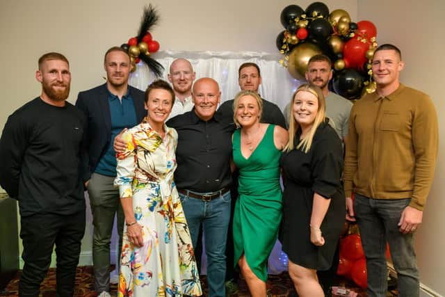 St John Fisher Catholic High School Charity Night at the DW Stadium Marquee:  Retiring deputy headteacher Steve Coyle (front centre) with headteacher Alison Rigby, left, event organisers Laura Melling and Abby Cunliffe, from the pastoral team, and former/current Wigan Warriors stars Sam Tomkins, Paul Prescott, Liam Farrell, Stuart Jones, Sean O'Loughlin and Joel Tomkins