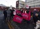 Members of the Communications Workers Union (CWU) and supporters brave freezing temperatures on the picket line outside Royal Mail's office on Hallgate, Wigan