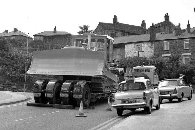 Retro 1960s - A bulldozer blocks the road in Standish, a Ford Anglia police car attends the scene - 1969