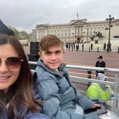 Alex and Jack Johnson in their seats outside Buckingham Palace for the King's coronation