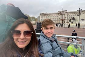 Alex and Jack Johnson in their seats outside Buckingham Palace for the King's coronation