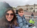 Alex and Jack Johnson in their seats outside Buckingham Palace for the King's coronation