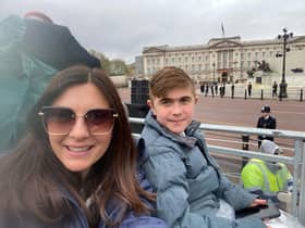 Alex and Jack Johnson in their seats outside Buckingham Palace for the King's coronation