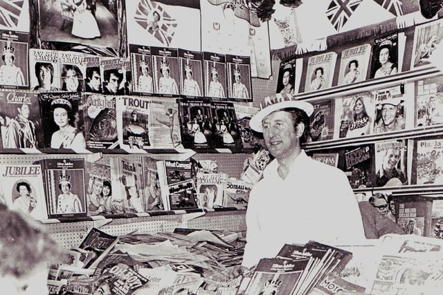 Celebrating the Queen's silver jubilee on a newsagent's stall in the old Wigan market hall in 1977.
