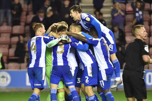 The Latics players celebrate the Carabao Cup victory over Bolton at the start of the season