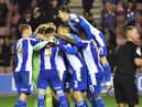 The Latics players celebrate the Carabao Cup victory over Bolton at the start of the season