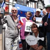 The entente cordiale between Wigan and Angers has been fostered for decades now. Here are volunteers flying the French flag at last year's Rotary Club community day in Wigan town centre