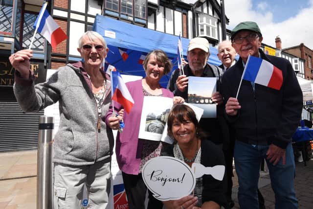 The entente cordiale between Wigan and Angers has been fostered for decades now. Here are volunteers flying the French flag at last year's Rotary Club community day in Wigan town centre