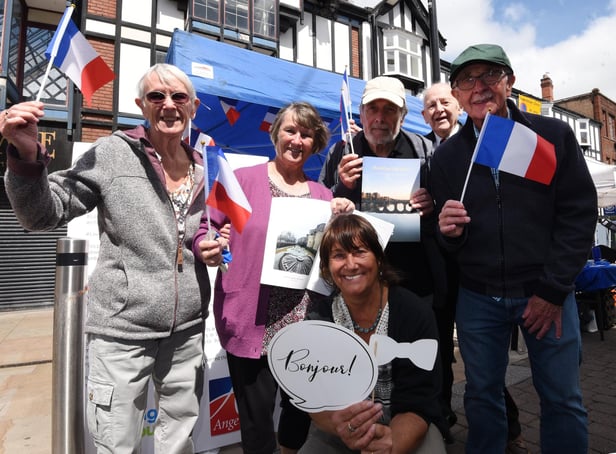 The entente cordiale between Wigan and Angers has been fostered for decades now. Here are volunteers flying the French flag at last year's Rotary Club community day in Wigan town centre