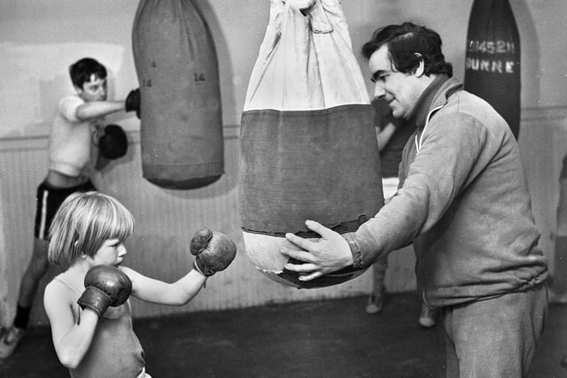 One of the youngest members, 9 year old Les Rigby, with trainer, Jim Doherty, at Ashton Boxing Club in February 1977.