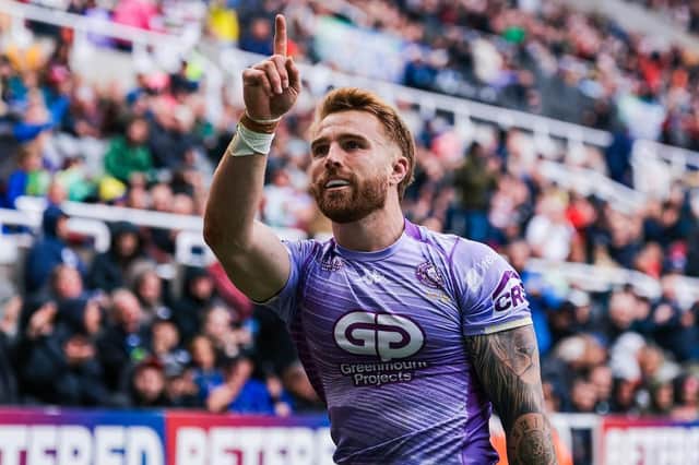Adam Keighran celebrates scoring a try for Wigan Warriors at Magic Weekend