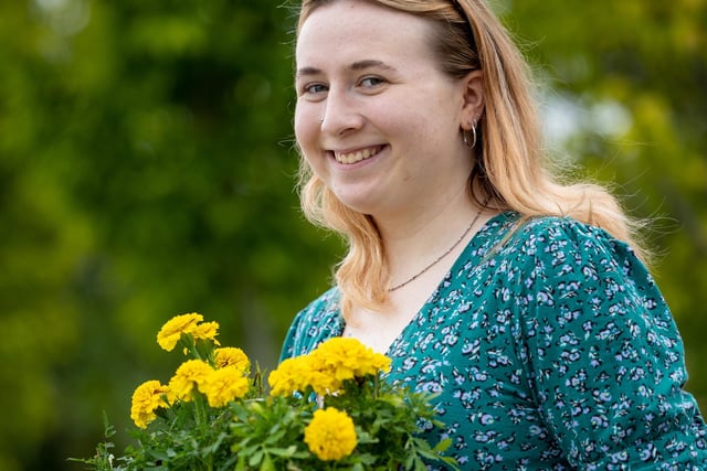 Izzy Nicholson with some colourful flowers