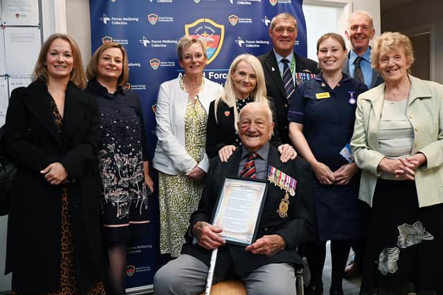D-Day veteran James Belcher, with family, friends and members of the armed forces community, as he received his wartime medals
