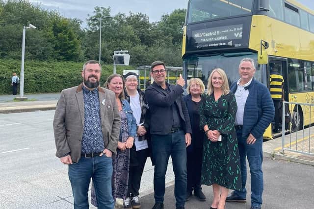 Councillors with Mayor of Greater Manchester Andy Burnham and Labour's parliamentary candidate for Leigh Jo Platt with a V2 bus