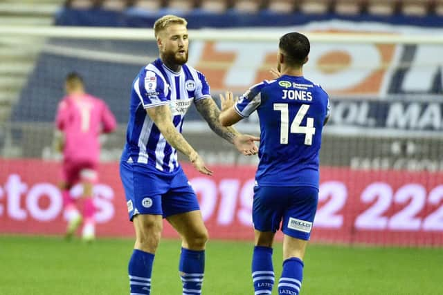 Stephen Humphrys takes the congratulations from Jordan Jones after his goal against Fleetwood