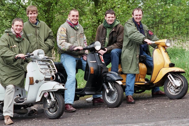 Scooter enthusiasts during a rally at the Douglas Valley ground of Wigan Rugby Union Club on Saturday 8th of May 1999.