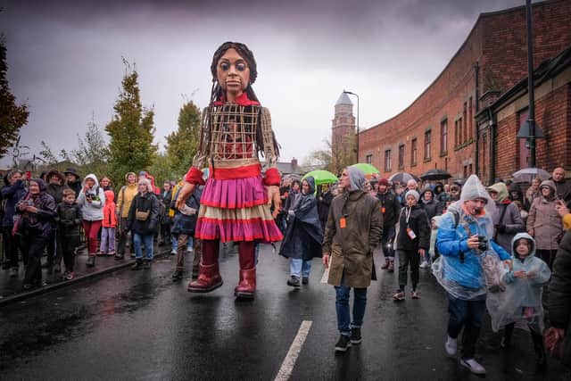 A flashback to Little Amal walking through Wigan in November 2021. The same artists are involved in The Herds which is coming to Pennington Park this summer