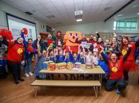 Amazon staff with pupils at Meadowbank Primary School's breakfast club