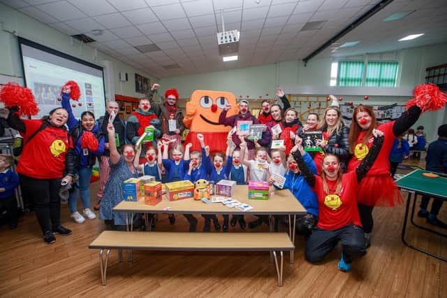 Amazon staff with pupils at Meadowbank Primary School's breakfast club