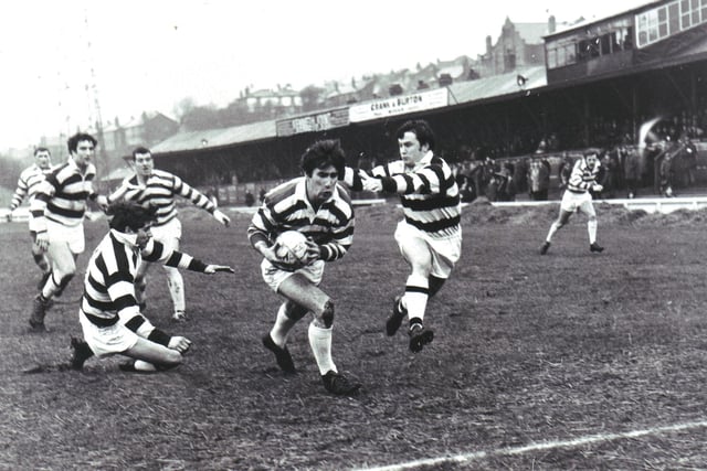 1969 - Wigan stand-off Kevin O'Loughlin breaks between Widnes defenders Dutton and O'Neill to score a try at Central Park.