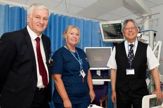 Andrew Foster at the hospital with staff including Dr Nayyar Naqvi