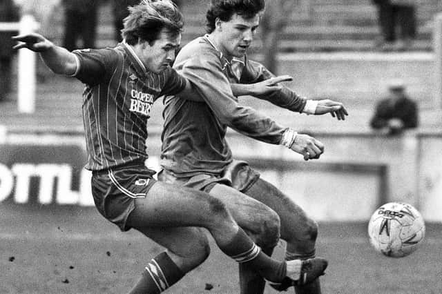 Wigan Athletic defender Steve Walsh challenges for the ball against Bournemouth in the Division 3 match at Springfield Park on Saturday 30th of March 1985. Latics lost the game 1-2 with Paul Jewell scoring their goal.