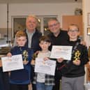 Finley McKeown, Zac Jackson and Alex James receive awards from councillors Ron Conway and Chris Ready