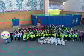 Volunteers, from three Wigan primary schools and Wigan and Leigh College made their way to the Brick Community Stadium, where they piled up their collected bags of litter.